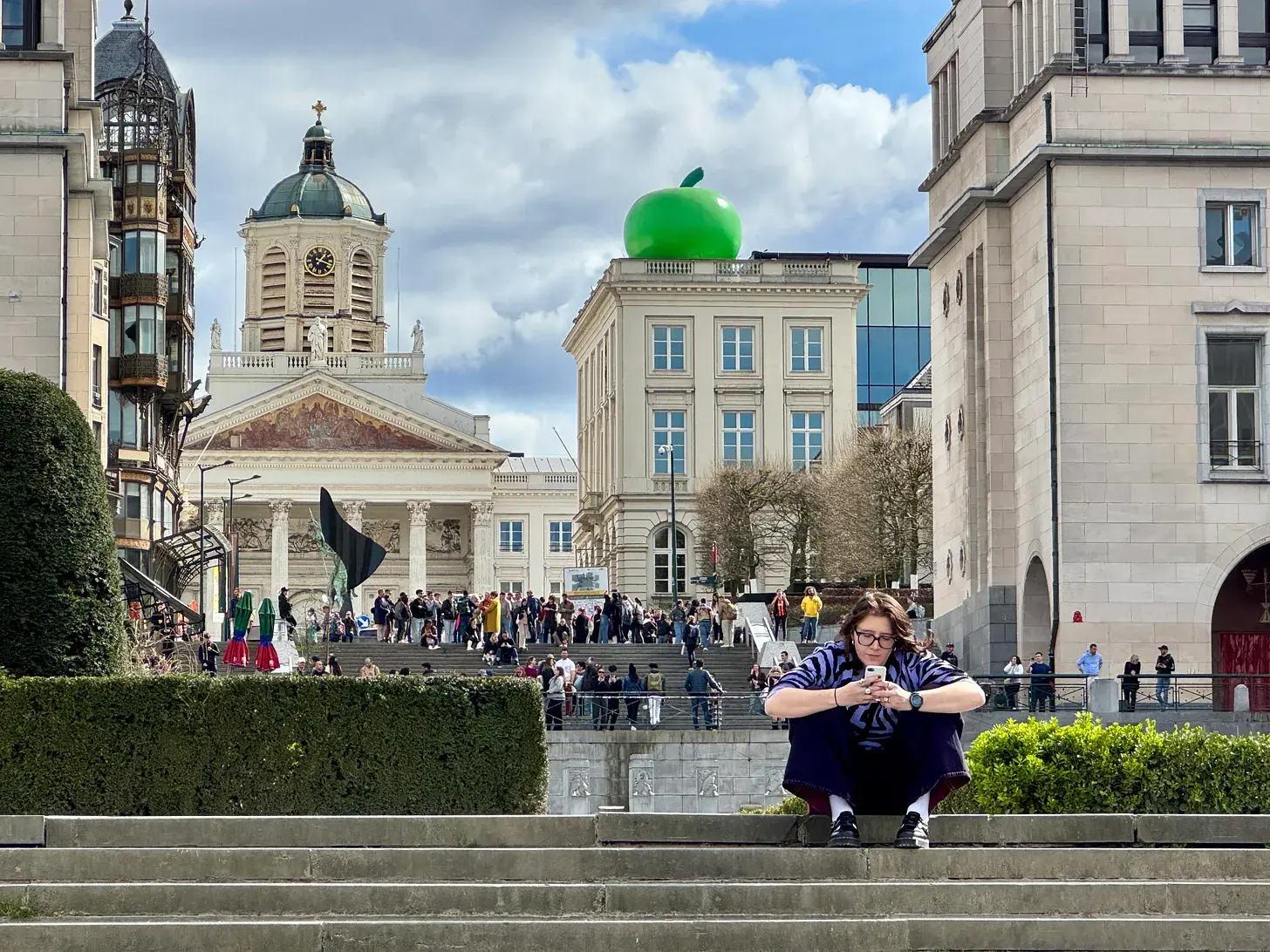 Looking up the Mont des Arts (Kunstberg) to the museum dedicated to the Belgian surrealist painter René Magritte, in whose honour an outsize green apple sits on the roof.